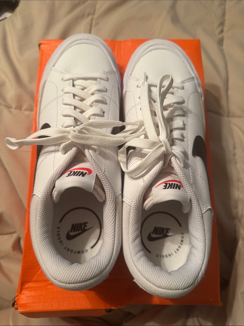 Nike Women’s White Sneakers with Black Swoosh and Red Tongue Logo